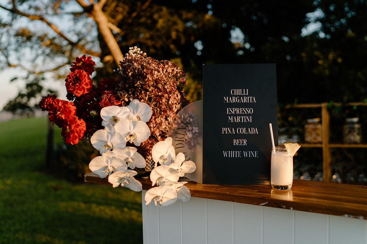 Romantic Winter Wedding inspiration featuring a black sign for the bar by Laura Elizabeth Design.